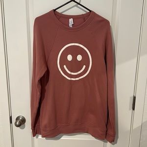 Mauve smiley face crewneck sweatshirt. Women’s Large